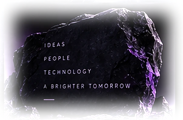 A dark stone slab engraved with: Ideas. People. Technology. A brighter tomorrow.